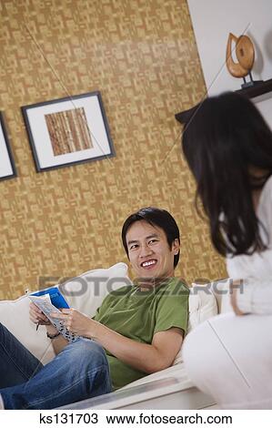 Smiling Man Relaxing At Home Stock Image Ks131703 Fotosearch