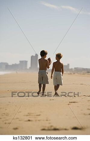Stock Photography Of Boys Walking Along Beach Ks132801 Search Boys Walking Along Beach