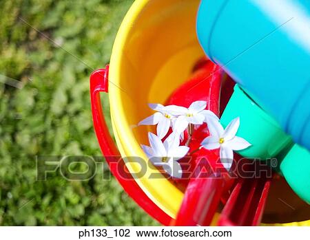 A plastic bucket and spade View Large Photo Image Stock Image - A plastic bucket and spade. Fotosearch
