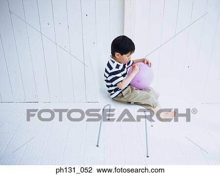 Asian child writing on a balloon View Large Photo Image Stock Image - Asian child writing on a balloon. Fotosearch