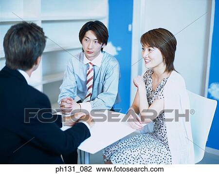 Asian couple in a conversation View Large Photo Image Stock Image - Asian couple in a conversation. Fotosearch