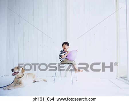 Asian kid sitting with his dog View Large Photo Image Picture - Asian kid sitting with his dog. Fotosearch