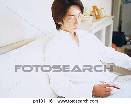 Asian man busy working View Large Photo Image Stock Image - Asian man busy working. Fotosearch