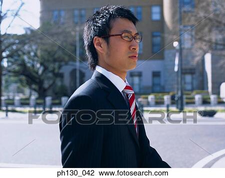 Asian Man crossing the street View Large Photo Image Stock Image - Asian Man crossing the street. Fotosearch