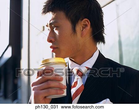 Asian Man waiting by the street View Large Photo Image Stock Image - Asian Man waiting by the street. Fotosearch