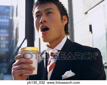 Asian Man waiting by the street View Large Photo Image Stock Image - Asian Man waiting by the street. Fotosearch