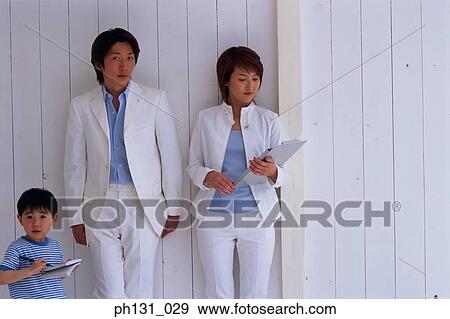 Stock Photo - Asian parents and their son. Fotosearch