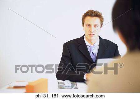 Caucasian man at a meeting View Large Photo Image Stock Image - Caucasian man at a meeting. Fotosearch