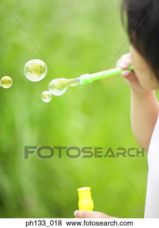 Child blowing bubbles View Large Photo Image Stock Photo - Child blowing bubbles. Fotosearch