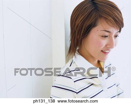 Stock Photo - Close up of a Asian woman's face. Fotosearch