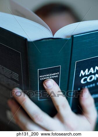 Stock Image - Close up of a book being read. Fotosearch