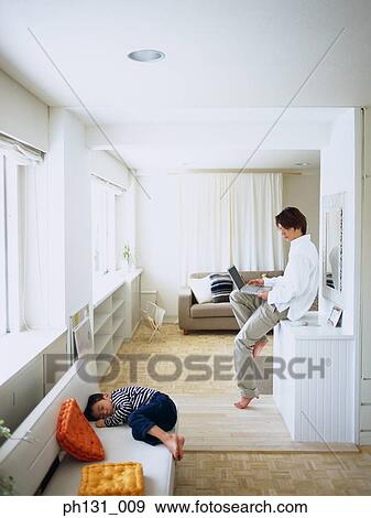 Father watching his son sleep View Large Photo Image Stock Photo - Father watching his son sleep. Fotosearch