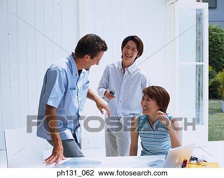 Group of friends in a discussion View Large Photo Image Stock Image - Group of friends in a discussion. Fotosearch