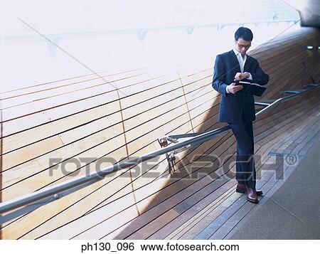Man waiting in a corridor View Large Photo Image Stock Photograph - Man waiting in a corridor. Fotosearch