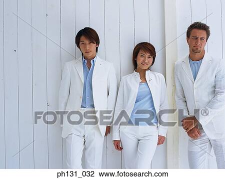 People standing against a wall View Large Photo Image Stock Image - People standing against a wall. Fotosearch