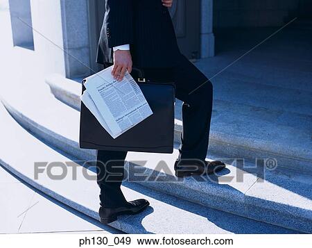 Person climbing steps of an entrance View Large Photo Image Stock Photo - Person climbing steps of an entrance. Fotosearch