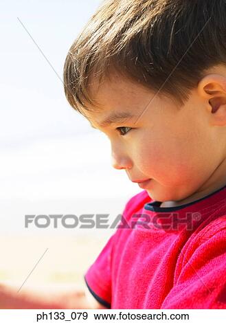 Stock Photo - Young boy concentrating. Fotosearch