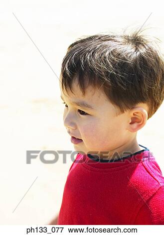 Stock Photo - Young boy looking sideway. Fotosearch