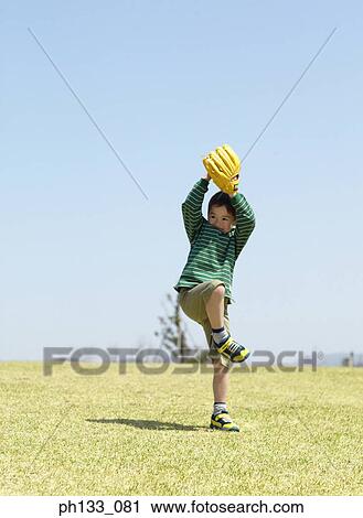 Stock Image - Young boy playing baseball. Fotosearch