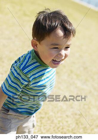 Stock Photo - Young boy smiling. Fotosearch