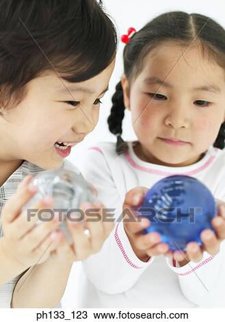 Young children holding glass balls View Large Photo Image Stock Image - Young children holding glass balls. Fotosearch