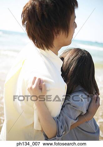 Young couple at beach View Large Photo Image Stock Photo - Young couple at beach. Fotosearch