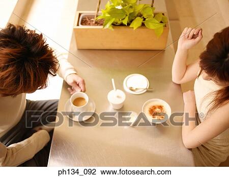 Young couple having tea View Large Photo Image Stock Image - Young couple having tea. Fotosearch