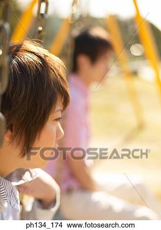 Picture - Young couple on swing. Fotosearch