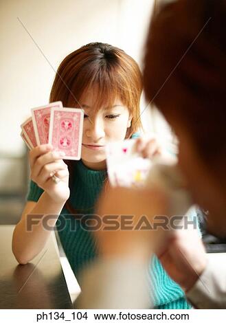 Young couple playing cards View Large Photo Image Picture - Young couple playing cards. Fotosearch