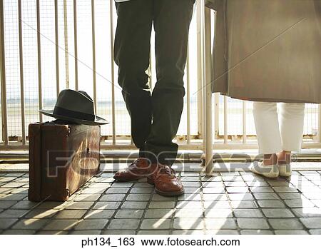 Young couple standing View Large Photo Image Stock Image - Young couple standing. Fotosearch