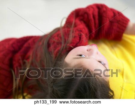 Young girl looking up View Large Photo Image Stock Photo - Young girl looking up. Fotosearch