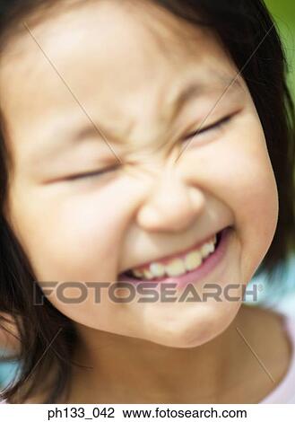 Stock Image - Young girl smiling. Fotosearch