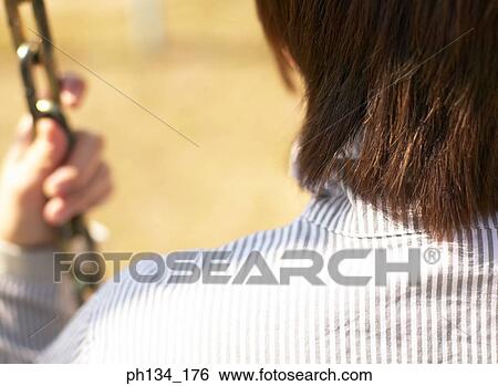Young lady on swing View Large Photo Image Stock Photograph - Young lady on swing. Fotosearch