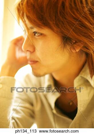 Stock Image - Young man looking. Fotosearch