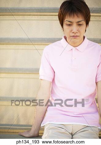 Young man sitting View Large Photo Image Stock Image - Young man sitting. Fotosearch