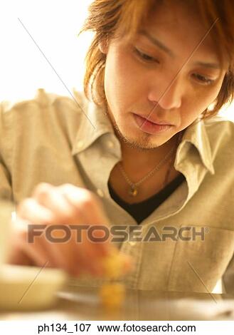 Young man with dice View Large Photo Image Stock Photo - Young man with dice. Fotosearch