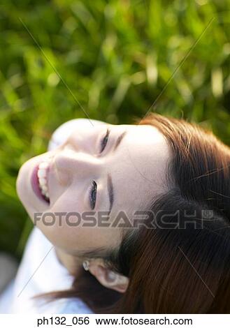 Stock Photograph - Young woman laughing. Fotosearch