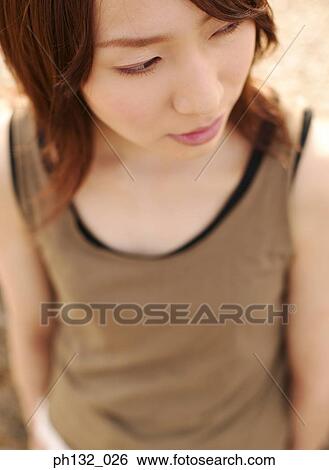 Young woman looking away View Large Photo Image Stock Photograph - Young woman looking away. Fotosearch