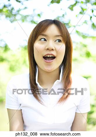 Young woman looking sideway View Large Photo Image Stock Photo - Young woman looking sideway. Fotosearch