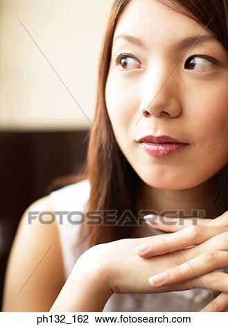 Young woman looking sideways View Large Photo Image Stock Image - Young woman looking sideways. Fotosearch