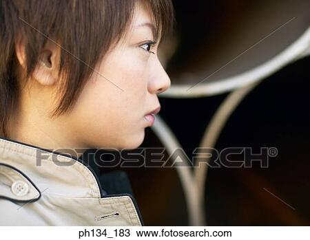 Young woman looking View Large Photo Image Stock Image - Young woman looking. Fotosearch