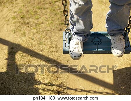 Young woman on swing View Large Photo Image Stock Image - Young woman on swing. Fotosearch