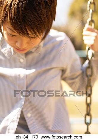 Young woman on swing View Large Photo Image Stock Photo - Young woman on swing. Fotosearch