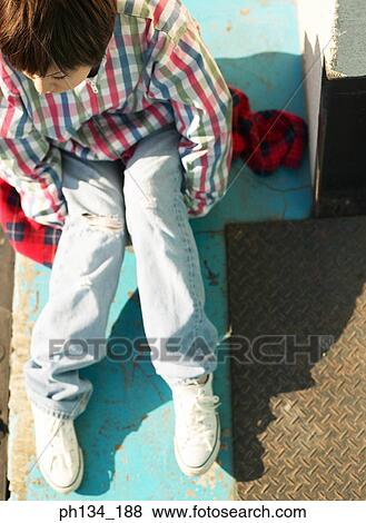Stock Photo - Young woman sitting. Fotosearch