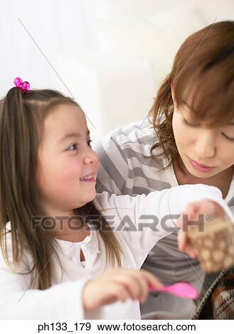 Stock Photo - Young woman with her daughter. Fotosearch