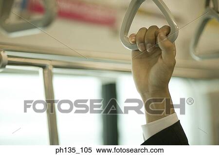 Person holding a safety handle View Large Photo Image Stock Photography - Person holding a safety handle. Fotosearch