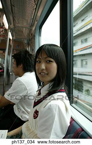 Picture - Teenage girl sitting in a train. Fotosearch