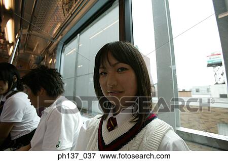 Teenage girl sitting in a train View Large Photo Image Stock Photo - Teenage girl sitting in a train. Fotosearch