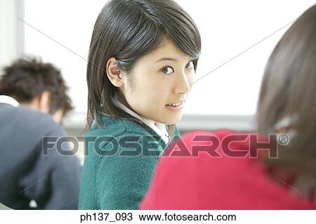 Stock Image - Teenagers in class. Fotosearch