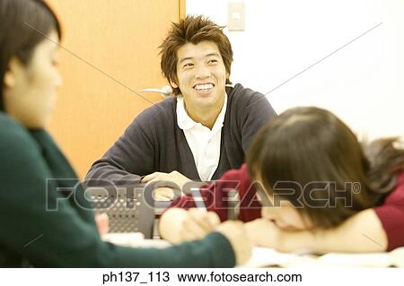 Stock Image - Teenagers in class. Fotosearch